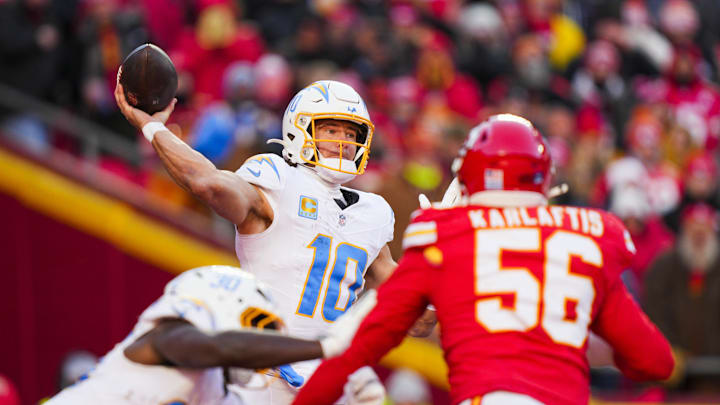 Dec 14, 2025; Kansas City, Missouri, USA; Los Angeles Chargers quarterback Justin Herbert (10) passes against the Kansas City Chiefs during the fourth quarter at GEHA Field at Arrowhead Stadium. Mandatory Credit: Jay Biggerstaff-Imagn Images