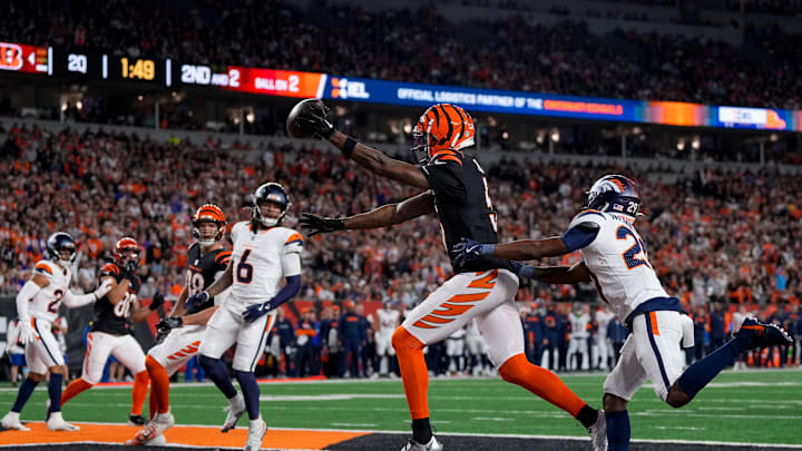 Cincinnati Bengals wide receiver Tee Higgins (5) catches a pass in the end zone for a touchdown in the second quarter of the NFL Week 17 game between the Cincinnati Bengals and the Denver Broncos at Paycor Stadium in downtown Cincinnati on Saturday, Dec. 28, 2024. Cincinnati Bengals wide receiver Tee Higgins (5) catches a pass in the end zone for a touchdown in the second quarter of the NFL Week 17 game between the Cincinnati Bengals and the Denver Broncos at Paycor Stadium in downtown Cincinnati on Saturday, Dec. 28, 2024.