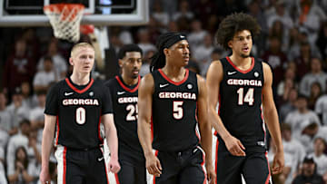 Feb 11, 2025; College Station, Texas, USA; Georgia Bulldogs guard Blue Cain (0), guard Silas Demary Jr. (5) and forward Asa Newell (14) walk on the court during the second half against the Texas A&M Aggies at Reed Arena. Mandatory Credit: Maria Lysaker-Imagn Images 