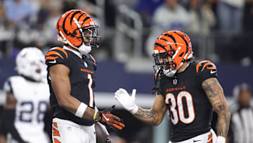 Dec 9, 2024; Arlington, Texas, USA;  Cincinnati Bengals wide receiver Ja'Marr Chase (1) and running back Chase Brown (30) celebrate a touchdown in the fourth quarter against the Dallas Cowboys at AT&T Stadium. Mandatory Credit: Tim Heitman-Imagn Images