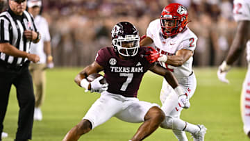 Sep 2, 2023; College Station, Texas, USA; New Mexico Lobos cornerback Zach Morris (2) applies pressure to Texas A&M Aggies wide receiver Moose Muhammad III (7) as he runs the ball during the fourth quarter at Kyle Field. Mandatory Credit: Maria Lysaker-USA TODAY Sports