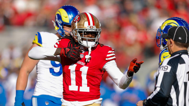 Jan 7, 2024; Santa Clara, California, USA; San Francisco 49ers wide receiver Brandon Aiyuk (11) celebrates after a play against the Los Angeles Rams during the first quarter at Levi's Stadium. Mandatory Credit: Sergio Estrada-USA TODAY Sports