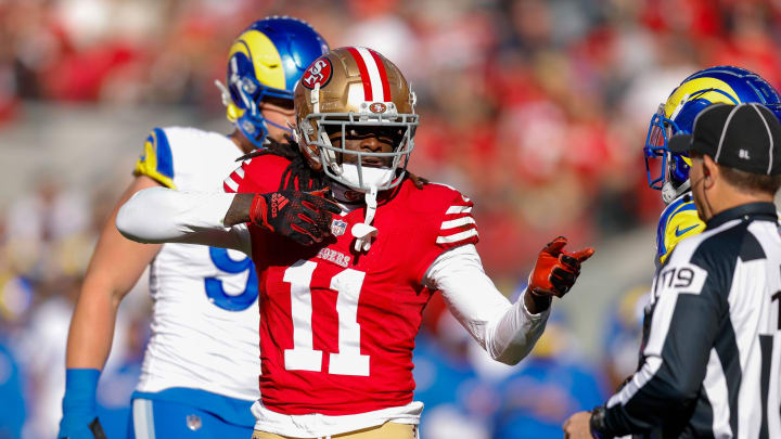 Jan 7, 2024; Santa Clara, California, USA; San Francisco 49ers wide receiver Brandon Aiyuk (11) celebrates after a play against the Los Angeles Rams during the first quarter at Levi's Stadium. Mandatory Credit: Sergio Estrada-USA TODAY Sports