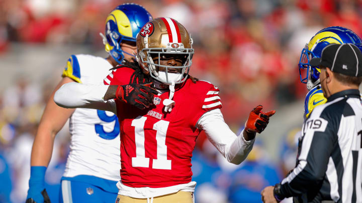 Jan 7, 2024; Santa Clara, California, USA; San Francisco 49ers wide receiver Brandon Aiyuk (11) celebrates after a play against the Los Angeles Rams during the first quarter at Levi's Stadium. Mandatory Credit: Sergio Estrada-USA TODAY Sports