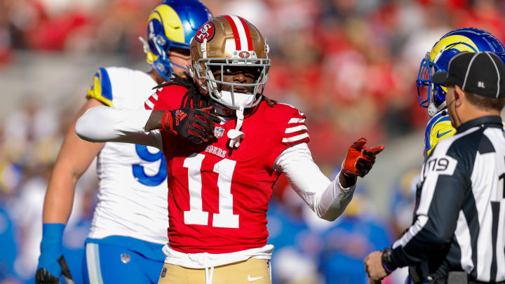 Jan 7, 2024; Santa Clara, California, USA; San Francisco 49ers wide receiver Brandon Aiyuk (11) celebrates after a play against the Los Angeles Rams during the first quarter at Levi's Stadium. Mandatory Credit: Sergio Estrada-USA TODAY Sports