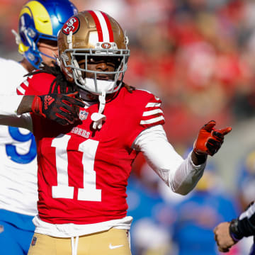 Jan 7, 2024; Santa Clara, California, USA; San Francisco 49ers wide receiver Brandon Aiyuk (11) celebrates after a play against the Los Angeles Rams during the first quarter at Levi's Stadium. Mandatory Credit: Sergio Estrada-USA TODAY Sports