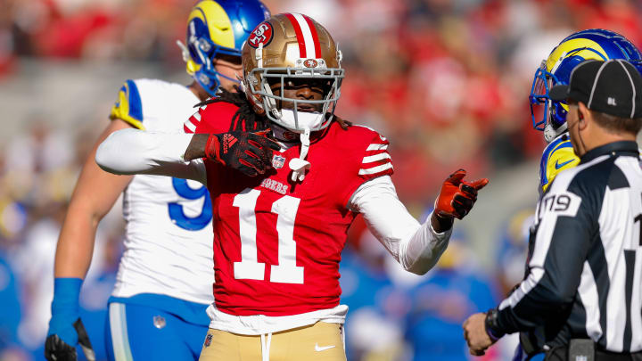 Jan 7, 2024; Santa Clara, California, USA; San Francisco 49ers wide receiver Brandon Aiyuk (11) celebrates after a play against the Los Angeles Rams during the first quarter at Levi's Stadium. Mandatory Credit: Sergio Estrada-USA TODAY Sports