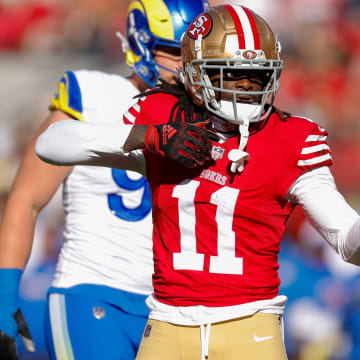 Jan 7, 2024; Santa Clara, California, USA; San Francisco 49ers wide receiver Brandon Aiyuk (11) celebrates after a play against the Los Angeles Rams during the first quarter at Levi's Stadium.