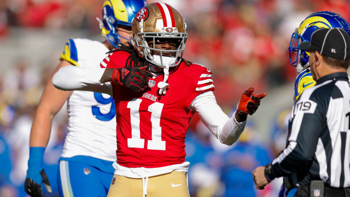 Jan 7, 2024; Santa Clara, California, USA; San Francisco 49ers wide receiver Brandon Aiyuk (11) celebrates after a play against the Los Angeles Rams during the first quarter at Levi's Stadium.