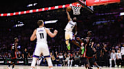 Nov 4, 2024; Miami, Florida, USA; Sacramento Kings guard Malik Monk (0) dunks the basketball again st Miami Heat center Bam Adebayo (13) during the fourth quarter at Kaseya Center. Mandatory Credit: Sam Navarro-Imagn Images
