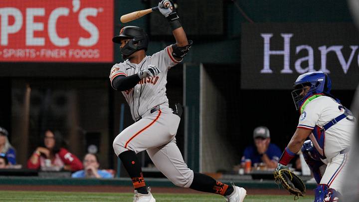 Aug 4, 2026; Arlington, Texas, USA;  San Francisco Giants left fielder Eddys Leonard (49) lines out to second against the Texas Rangers during the fourth inning at Globe Life Field. Mandatory Credit: Raymond Carlin III-Imagn Images