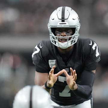 Nov 2, 2025; Paradise, Nevada, USA; Las Vegas Raiders quarterback Geno Smith (7) takes the snap against the Jacksonville Jaguars at Allegiant Stadium. Mandatory Credit: Kirby Lee-Imagn Images