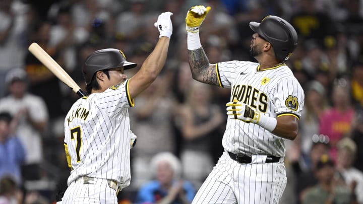 Aug 13, 2024; San Diego, California, USA; San Diego Padres right fielder David Peralta (24) celebrates with shortstop Ha-Seong Kim (7) after hitting a home run against the Pittsburgh Pirates during the fifth inning at Petco Park. Mandatory Credit: Orlando Ramirez-USA TODAY Sports