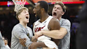Nov 10, 2025; Miami, Florida, USA;  Miami Heat forward Andrew Wiggins (22) reacts to winning the game with teammates against the Cleveland Cavaliers during overtime at Kaseya Center. Mandatory Credit: Rhona Wise-Imagn Images