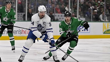 Dec 18, 2024; Dallas, Texas, USA; Toronto Maple Leafs center Auston Matthews (34) and Dallas Stars center Mavrik Bourque (22) chase the puck during the third period at the American Airlines Center. Mandatory Credit: Jerome Miron-Imagn Images
