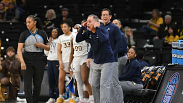 Mar 23, 2024; Iowa City, IA, USA; West Virginia Mountaineers head coach Mark Kellogg (middle) reacts during the second half against the Princeton Tigers of the NCAA first round game at Carver-Hawkeye Arena. Mandatory Credit: Jeffrey Becker-Imagn Images