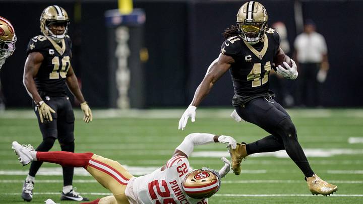 Sep 14, 2025; New Orleans, Louisiana, USA; New Orleans Saints running back Alvin Kamara (41) runs against San Francisco 49ers safety Jason Pinnock (25) during the second quarter at Caesars Superdome. Mandatory Credit: Matthew Hinton-Imagn Images
