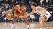 Mar 12, 2025; Nashville, TN, USA;  Vanderbilt Commodores guard Chris Manon (30) guards Texas Longhorns guard Tre Johnson (20) during the second half at Bridgestone Arena. Mandatory Credit: Steve Roberts-Imagn Images