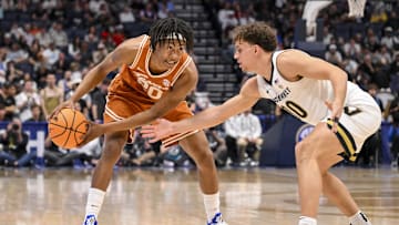 Mar 12, 2025; Nashville, TN, USA;  Vanderbilt Commodores guard Chris Manon (30) guards Texas Longhorns guard Tre Johnson (20) during the second half at Bridgestone Arena. Mandatory Credit: Steve Roberts-Imagn Images