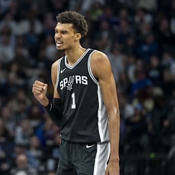 Dec 29, 2024; Minneapolis, Minnesota, USA; San Antonio Spurs center Victor Wembanyama (1) celebrates after making a shot against the Minnesota Timberwolves in the second half at Target Center. Mandatory Credit: Jesse Johnson-Imagn Images