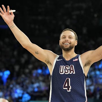 United States shooting guard Stephen Curry (4) celebrates in the second half against France in the men's basketball gold medal game during the Paris 2024 Olympic Summer Games at Accor Arena.