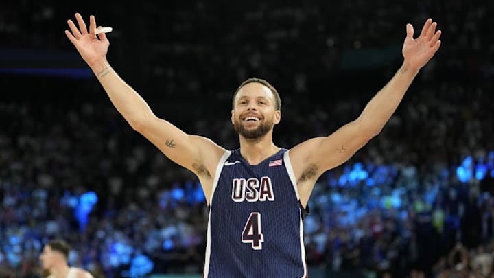 United States shooting guard Stephen Curry (4) celebrates in the second half against France in the men's basketball gold medal game during the Paris 2024 Olympic Summer Games at Accor Arena.