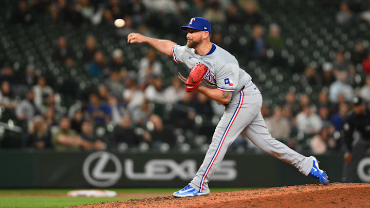 Texas Rangers relief pitcher Kirby Yates (39) pitches to the Seattle Mariners during the ninth inning at T-Mobile Park.