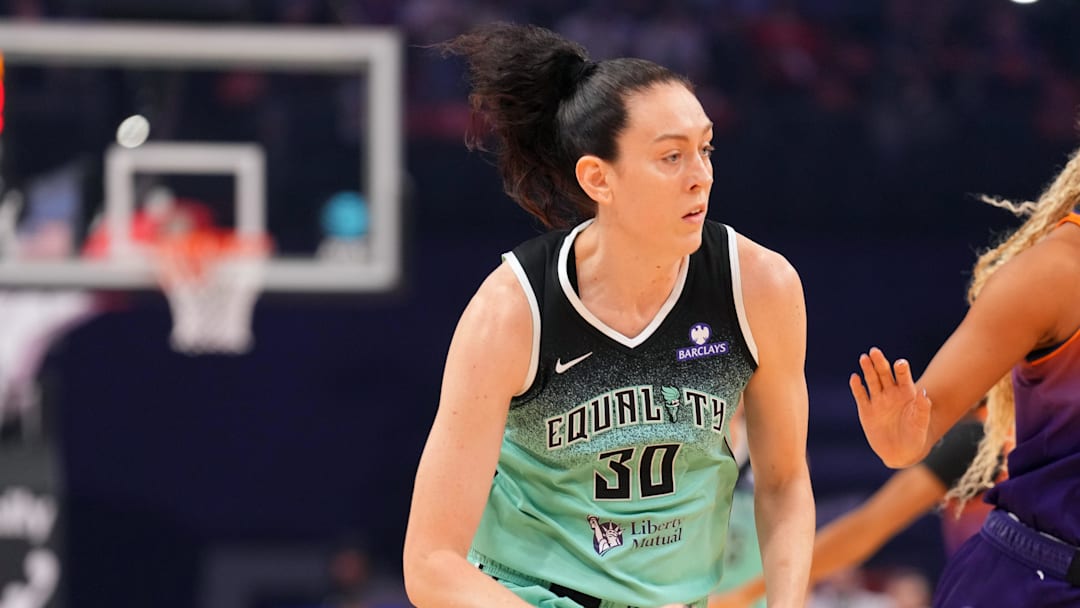 Sep 19, 2025; Phoenix, Arizona, USA; New York Liberty forward Breanna Stewart (30) dribbles by Phoenix Mercury forward Satou Sabally (0) during the first half of game three of round one for the 2025 WNBA Playoffs at PHX Arena. Mandatory Credit: Joe Camporeale-Imagn Images