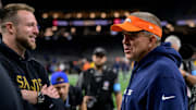 Oct 17, 2024; New Orleans, Louisiana, USA; New Orleans Saints tight end Taysom Hill (7) talks to his former coach Denver Broncos head coach Sean Payton at Caesars Superdome. Mandatory Credit: Matthew Hinton-Imagn Images