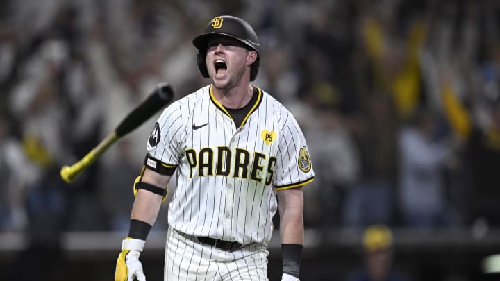 Jun 20, 2024; San Diego, California, USA; San Diego Padres second baseman Jake Cronenworth (9) tosses his bat after hitting a walk-off home run during the ninth inning against the Milwaukee Brewers at Petco Park. Mandatory Credit: Orlando Ramirez-USA TODAY Sports