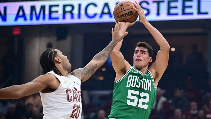 Oct 8, 2026; Cleveland, Ohio, USA;  Boston Celtics center Luka Garza (52) shoots against Cleveland Cavaliers guard Jaylon Tyson (20) during the first half of a preseason game at Rocket Arena.  Mandatory Credit: David Dermer-Imagn Images