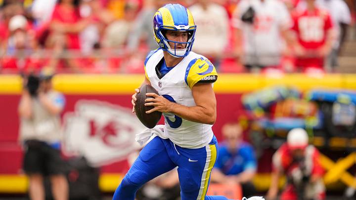 Aug 15, 2026; Kansas City, Missouri, USA; Los Angeles Rams quarterback Stetson Bennett IV (13) rolls out to pass during the first half against the Kansas City Chiefs at at Arrowhead Stadium. Mandatory Credit: Jay Biggerstaff-Imagn Images