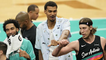 Nov 20, 2025; San Antonio, Texas, USA; San Antonio Spurs forward Victor Wembanyama (1) with teammates forwards Julian Champagnie (30) and Kelly Olynyk (8) during a time out in the first half against the Atlanta Hawks at Frost Bank Center.