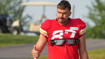 Jul 26, 2024; Kansas City, MO, USA; Kansas City Chiefs tight end Travis Kelce (87) waves to fans as he walks down the hill from the locker room to the fields prior to training camp at Missouri Western State University. Mandatory Credit: Denny Medley-USA TODAY Sports