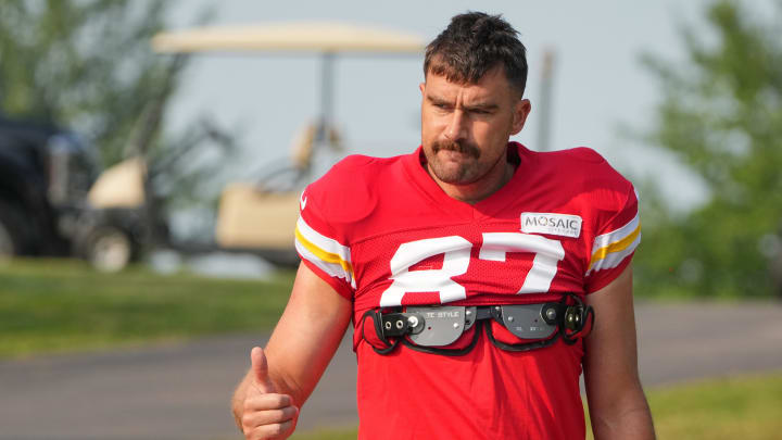 Jul 26, 2024; Kansas City, MO, USA; Kansas City Chiefs tight end Travis Kelce (87) waves to fans as he walks down the hill from the locker room to the fields prior to training camp at Missouri Western State University.