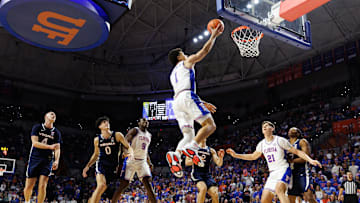 Dec 4, 2024; Gainesville, Florida, USA; Florida Gators guard Walter Clayton Jr. (1) makes a layup against the Virginia Cavaliers during the second half at Exactech Arena at the Stephen C. O'Connell Center. Mandatory Credit: Matt Pendleton-Imagn Images
