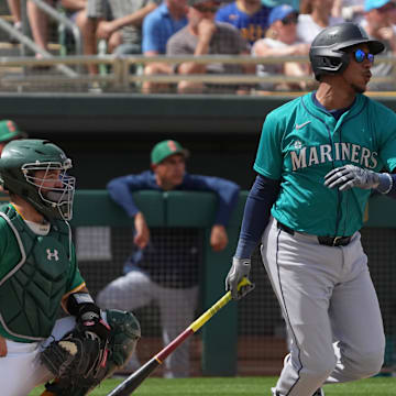 Seattle Mariners second base Jorge Polanco (7) hits against the Oakland Athletics in the third inning at Hohokam Stadium on March 17.