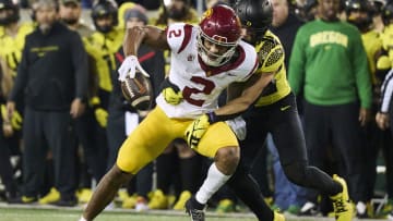 Nov 11, 2023; Eugene, Oregon, USA; USC Trojans wide receiver Brenden Rice (2) picks up a first down on a pass play during the second half against Oregon Ducks defensive back Evan Williams (33) at Autzen Stadium. Mandatory Credit: Troy Wayrynen-USA TODAY Sports