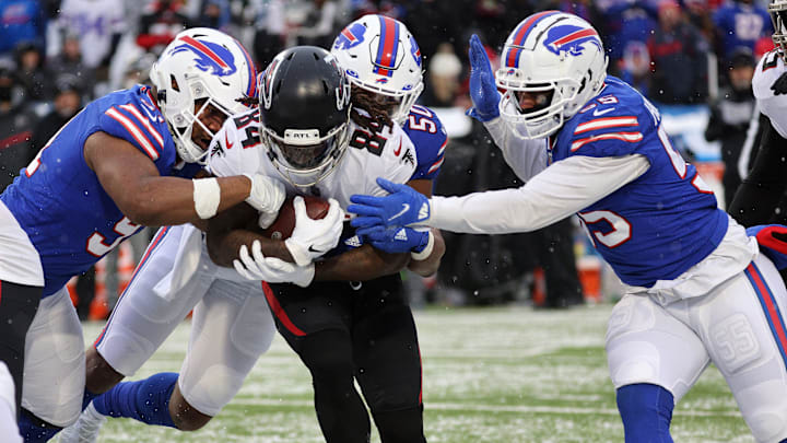 Buffalo Bills defenders Ed Oliver (L-R) Greg Rousseau and Jerry Hughes team up to stop Falcons running back Atlanta Cordarrelle Patterson. Buffalo Bills defenders Ed Oliver (L-R) Greg Rousseau and Jerry Hughes team up to stop Falcons running back Atlanta Cordarrelle Patterson.