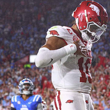 Sep 13, 2025; Oxford, Mississippi, USA; Arkansas Razorback quarterback Taylen Green (10) reacts after running for a touchdown during the second quarter against the Mississippi Rebels at Vaught-Hemingway Stadium. Mandatory Credit: Petre Thomas-Imagn Images