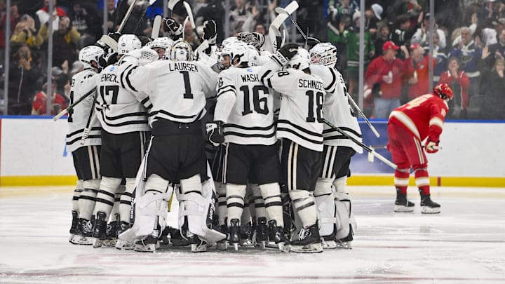 Apr 10, 2025; St. Louis, Missouri, UNITED STATES; Western Michigan Broncos forward Owen Michaels (34) celebrates with teammates after scoring the game winning goal against the Denver Pioneers in the second overtime during the Frozen Four college ice hockey national semifinals at Enterprise Center. Mandatory Credit: Jeff Curry-Imagn Images Apr 10, 2025; St. Louis, Missouri, UNITED STATES; Western Michigan Broncos forward Owen Michaels (34) celebrates with teammates after scoring the game winning goal against the Denver Pioneers in the second overtime during the Frozen Four college ice hockey national semifinals at Enterprise Center. Mandatory Credit: Jeff Curry-Imagn Images