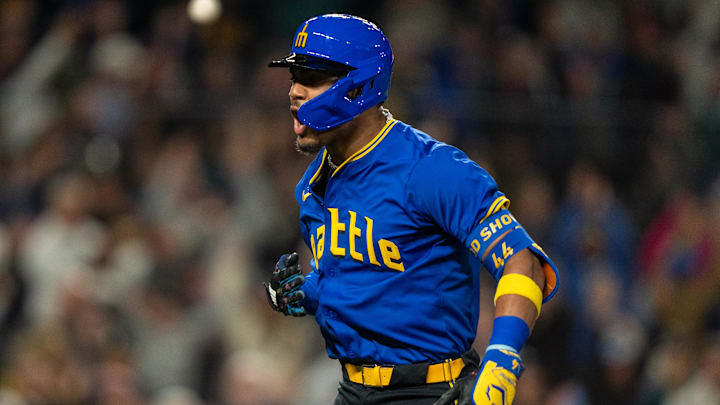 Seattle Mariners center fielder Julio Rodriguez celebrates after hitting a go-ahead home run during a game against the Texas Rangers on Friday at T-Mobile Park.