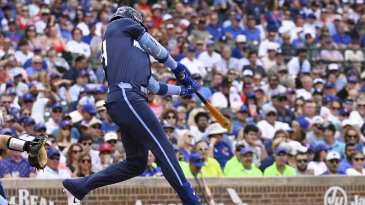 Aug 16, 2024; Chicago, Illinois, USA;  Chicago Cubs outfielder Cody Bellinger (24) hits a two run home run against the Toronto Blue Jays during the first inning at Wrigley Field. 