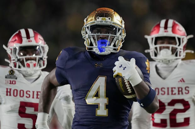 Notre Dame running back Jeremiyah Love scores a 98-yard touchdown in the first half.