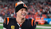 Bengals quarterback Joe Burrow celebrates a Week 17 overtime win over the Denver Broncos that kept Cincinnati's slim playoff hopes alive. Burrow threw for 412 yards and three touchdowns in the game and also added a rushing score.