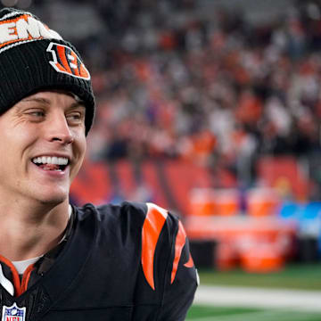Bengals quarterback Joe Burrow celebrates a Week 17 overtime win over the Denver Broncos that kept Cincinnati's slim playoff hopes alive. Burrow threw for 412 yards and three touchdowns in the game and also added a rushing score.