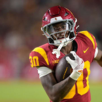 Sep 6, 2025; Los Angeles, California, USA; USC Trojans running back King Miller (30) carries the ball down the field for a touchdown in the second half against the Georgia Southern Eagles at the Los Angeles Memorial Coliseum. Mandatory Credit: Jayne Kamin-Oncea-Imagn Images