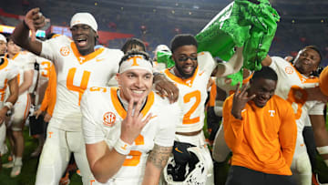 Tennessee quarterback Joey Aguilar (6), along with and defensive backs Ty Redmond (4) and Andre Turrentine (2), celebrate the win over Florida in an NCAA college football game on November 22, 2025, in Gainesville, Florida.