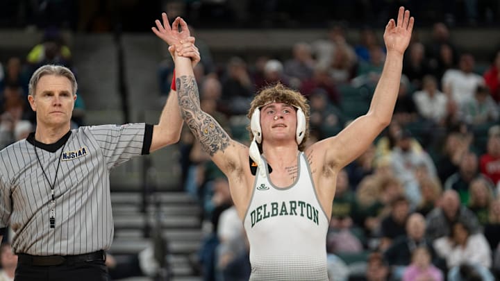 Delbarton’s Alessio Perentin’s hand is raised after defeating Christian Brothers Academy’s AJ Falcone in the championship 165lb match during finals of the NJSIAA individual wrestling state championships at Boardwalk Hall in Atlantic City on Friday, March 8, 2025. Delbarton’s Alessio Perentin is awarded the 165lb state championship title. Delbarton’s Alessio Perentin’s hand is raised after defeating Christian Brothers Academy’s AJ Falcone in the championship 165lb match during finals of the NJSIAA individual wrestling state championships at Boardwalk Hall in Atlantic City on Friday, March 8, 2025. Delbarton’s Alessio Perentin is awarded the 165lb state championship title.