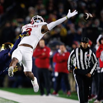 Notre Dame cornerback Leonard Moore (15) interrupts a reception attempt by Indiana wide receiver Omar Cooper Jr. (3) during the first round of the College Football Playoff between Notre Dame and Indiana on Friday, Dec. 20, 2024, in South Bend.